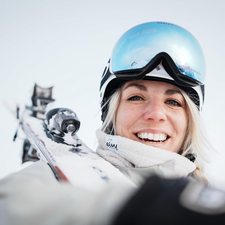 Kaveri Mehta, Lead Design Curator at SoftMeadowLark, reviewing corporate floral arrangements